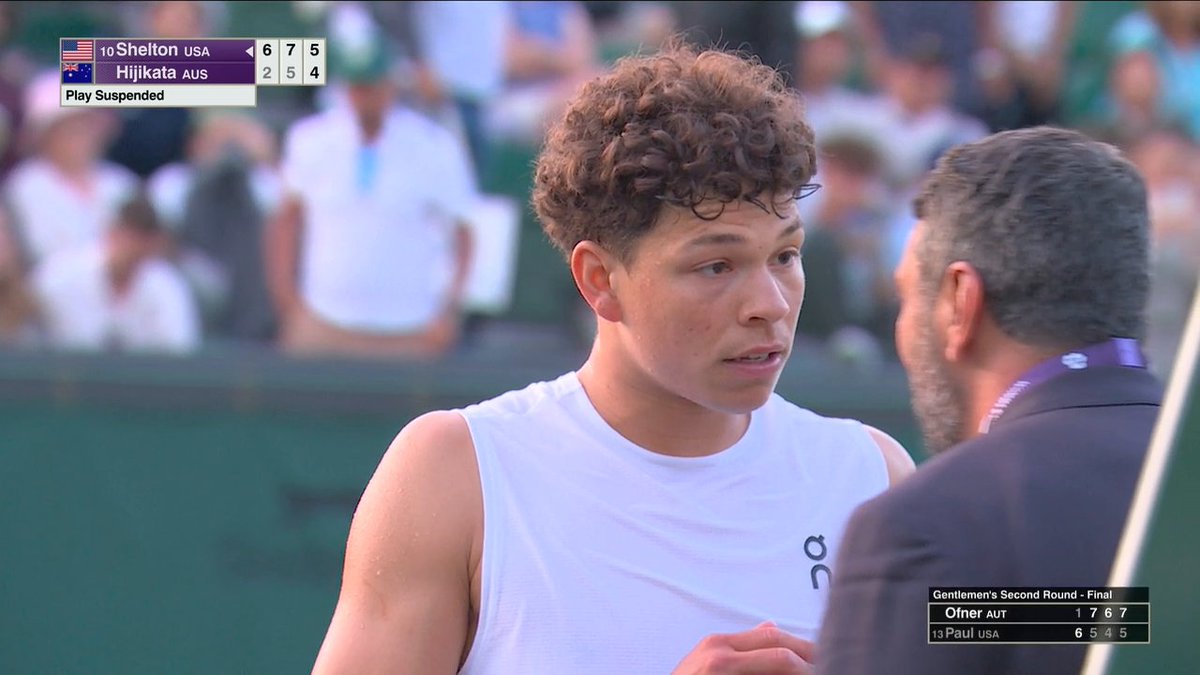 Ben Shelton reacts to his match against Rinky Hijikata being suspended at 9:29 PM local time. The match will be resumed tomorrow after play is suspended due to darkness.