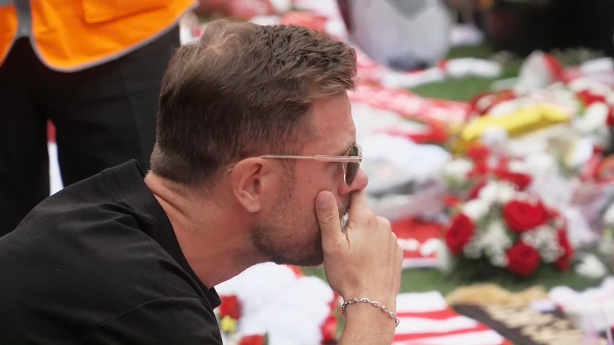 Former Liverpool midfielder Jordan Henderson pays his respects to Diogo Jota at Anfield.