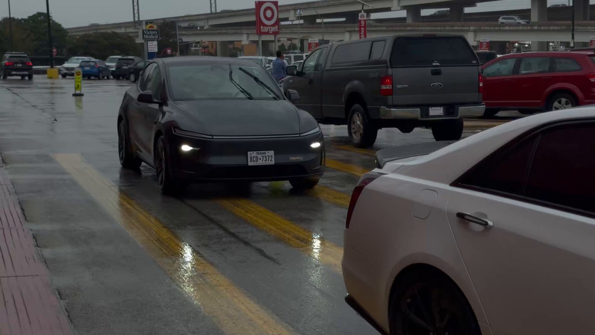 Tesla Robotaxi just parked in a parking spot when picking us up from Target!