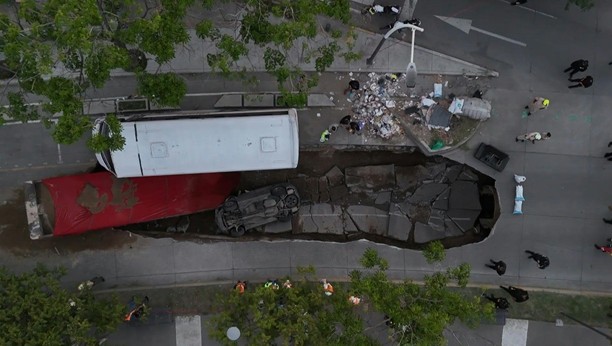 VIDEO: 🇲🇽 Mexico: massive sinkhole swallows two trucks in Guadalajara, no injuries reported Aerial images show the gaping sinkhole -- approximately 40 metres long by 10 metres wide -- that disrupted traffic and prompted an emergency response