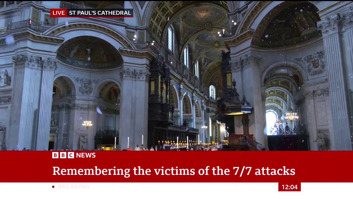 White petals fall from the dome and balconies of St Paul's Cathedral as names of the 7/7 London bombing victims are read out Follow live: