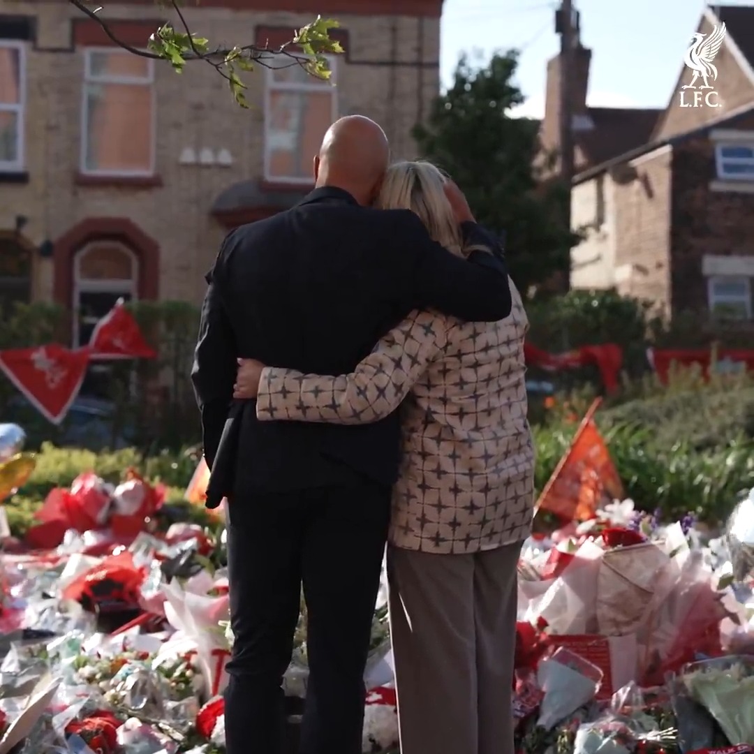 Michael Edwards, Andy Robertson and Arne Slot, alongside his wife, added flowers to the poignant array formed outside a ground that Jota lit up so often with his talents ❤️