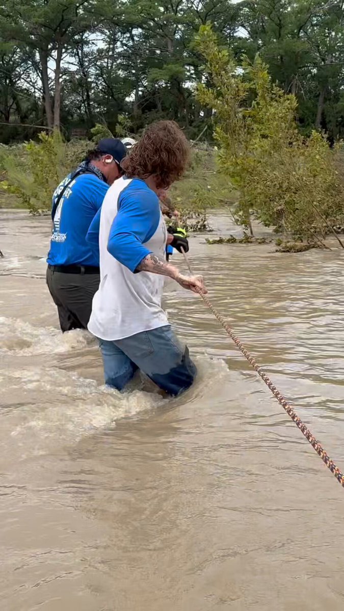 Crossing the river to search for bodies in Center Point, Texas