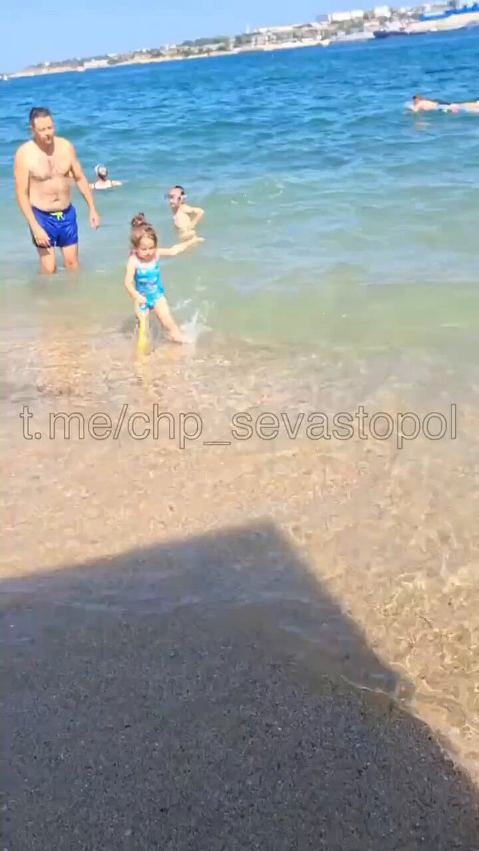Sevastopol, temporarily occupied Crimea. Families out on the beach… but there is a nuance… 🤦‍♂️