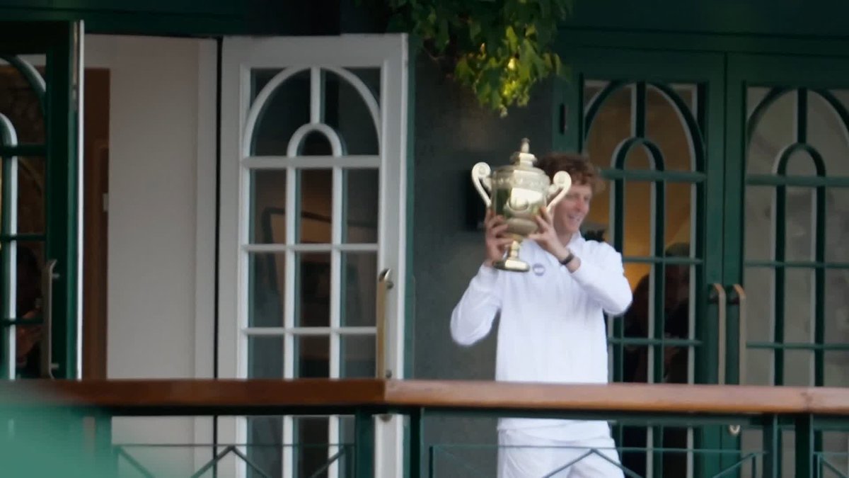 Jannik Sinner shows off his trophy after becoming the first ever Italian to win a Wimbledon singles title 🏆