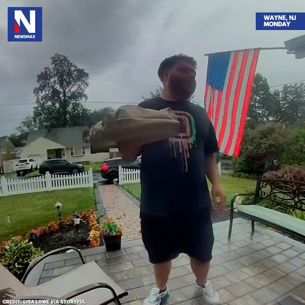 SHOCKING DELIVERY: A bolt of lightning just missed hitting a delivery driver outside a house in Wayne, New Jersey, on Monday.