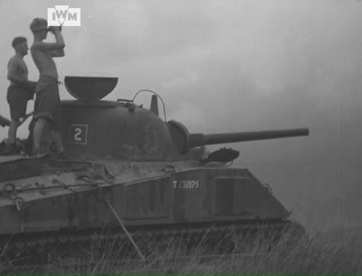 A Sherman fires at Japanese forces following their breakout in the Pegu Yomas mountain range in Burma, 21 July 1945. Film: IWM JFU 283