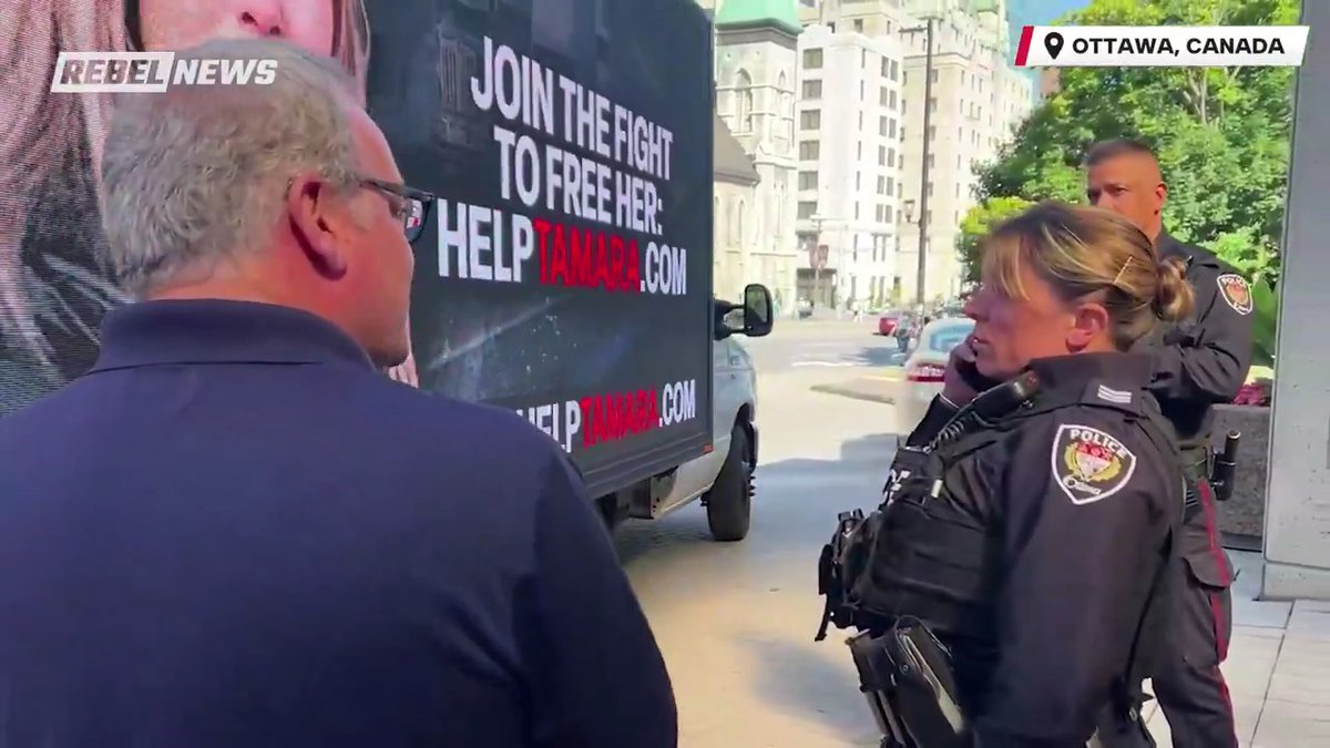 Rebel News boss @EzraLevant negotiates with Ottawa police as officers try to prevent the Rebel billboard truck from driving through the public drop-off area of the Ottawa courthouse.