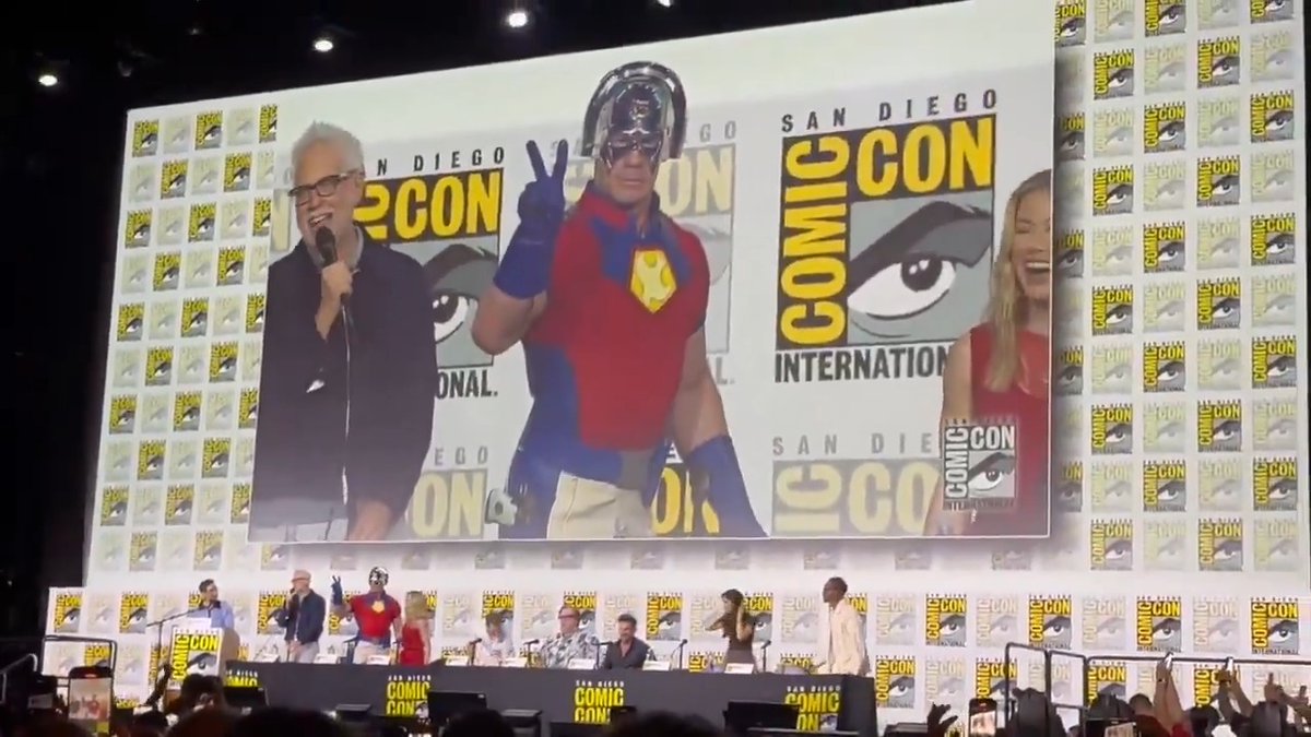 James Gunn welcomes John Cena to the stage during the #SDCC2025 panel for #Peacemaker season two