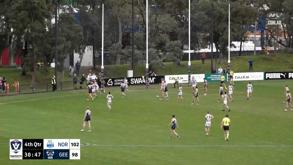 How's this for a finish in the VFL. A few seconds to go, North Melbourne leads Geelong by four points, play deep in the Cats' forward pocket. Ball bouncing harmlessly out of bounds, and then... Free kick for a push, 50 for dissent, Geelong goal after the siren to win. 🫣