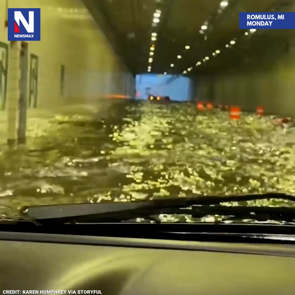 FLASH FLOODING: A terrified driver turned to prayer to try to stay calm while navigating a flooded tunnel on Monday, after severe thunderstorms caused flash flooding around the Detroit Metro Airport in Romulus, Michigan.