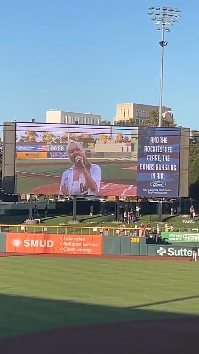 EVERYONE IN SUTTER HEALTH PARK LISTENING LILY SINGING NATIONAL ANTHEM OF THE UNITED STATES "STAR SPANGLED BANNER"