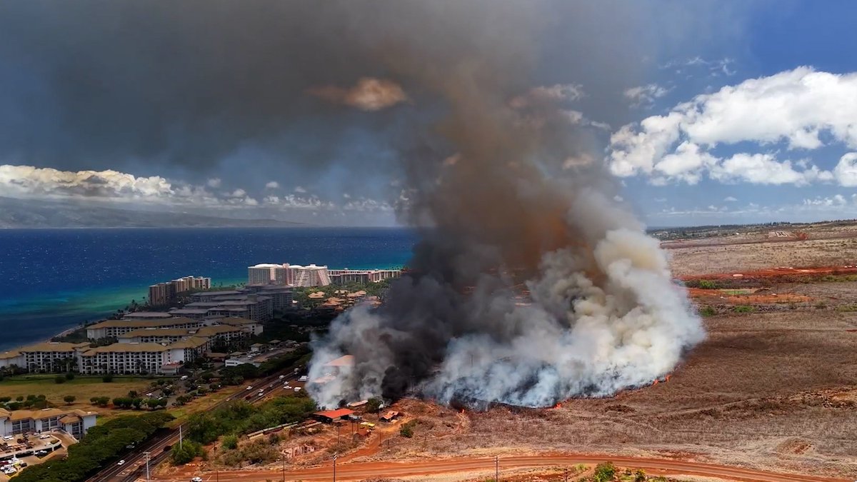 A drone followed the thick plumes of smoke from a brush fire near a highway in Hawaii almost two years after the devastating Lahaina wildfires. The fire has since been contained, according to Maui fire officials.