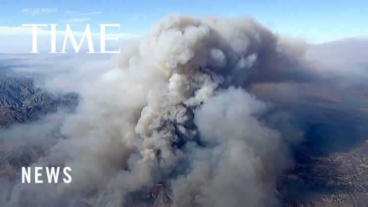 A fast-growing brush fire has forced thousands of people to evacuate in a mountainous area north of Los Angeles.