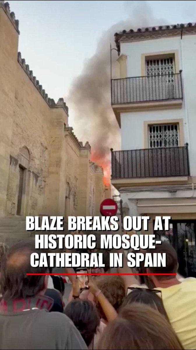 WATCH: Bystanders stand in shock when fire breaks out at the Mosque–Cathedral in Cordoba, Spain.