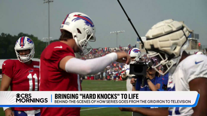 When it launched in 2001, HBO’s “Hard Knocks” helped revolutionize the way behind-the-scenes access was presented to the public. This year’s edition of the acclaimed series will focus on the Buffalo Bills. Nathaniel E Burleson got a first-hand look at how the NFL team is handling filming during training camp in western New York – and how the team behind the show manages its unprecedented access.