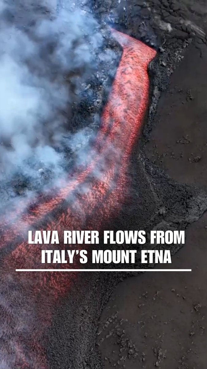 Drone footage shows an incredible lava river flowing from Mount Etna. Scientists say it currently does not pose a threat to a nearby town.