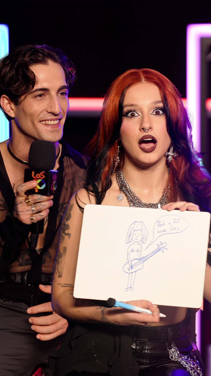 ¡Me acaba de 🤯! En #LOS40PrimaveraPop hicimos un juego que RUSLANA jamás olvidará (y nosotros tampoco) 👀 ¡La artista y Damiano David hicieron el mismo dibujo sin planearlo! Ambos pintaron a Victoria de Måneskin🎸 ¿Telepatía? Video completo en nuestro canal de YouTube🔗