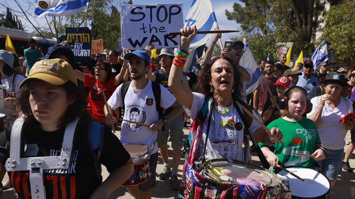 Thousands of Israelis stayed home from work, flooded city streets and blocked roads and highways across the country on Sunday, staging some of the largest anti-war protests in months as the military prepares for a major assault on Gaza City.