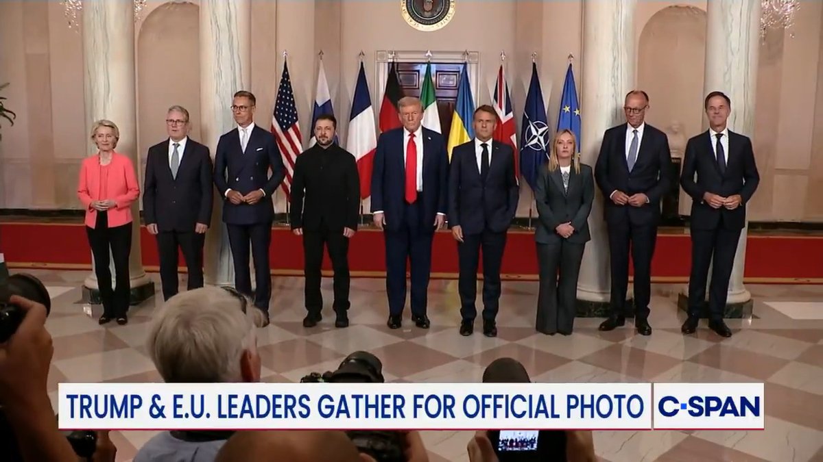 Presidents Trump and European leaders pose for a "family photo" at the White House.