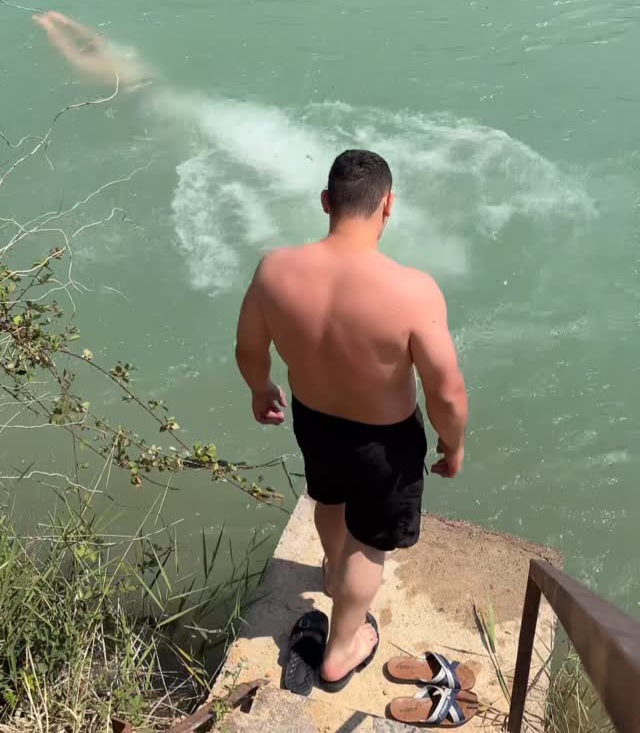 Never jump into a river if you swim like the second guy. He's lucky to be alive