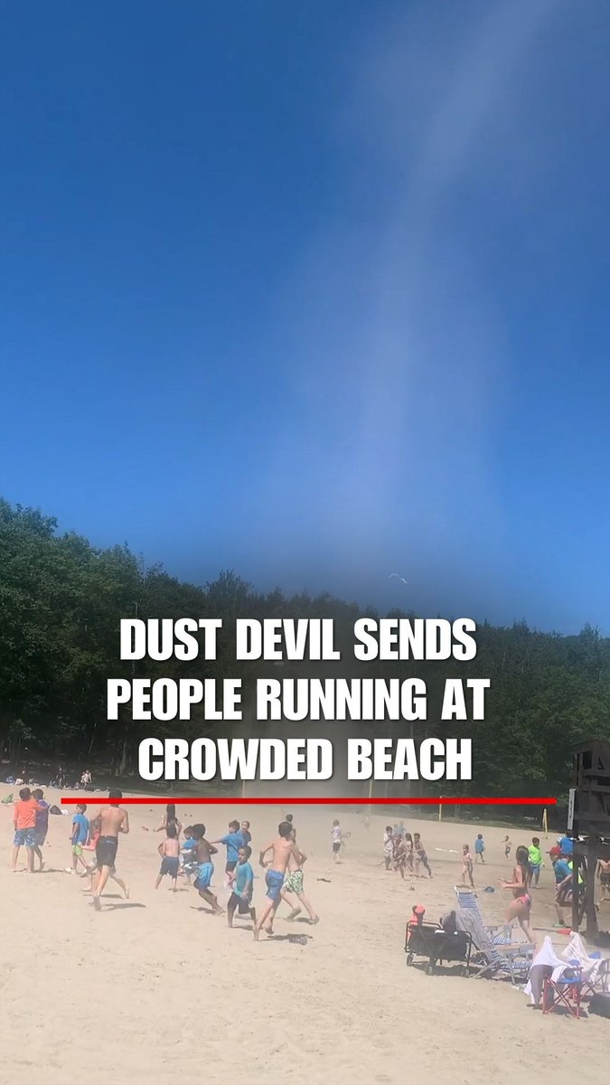 Children scramble to get out of the way when a dust devil forms over a beach in upstate New York.