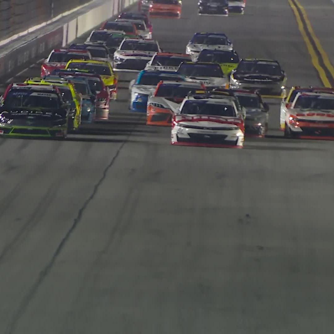 The green-and-white checkered flag flies! Sammy Smith wins Stage 1 at Daytona International Speedway.