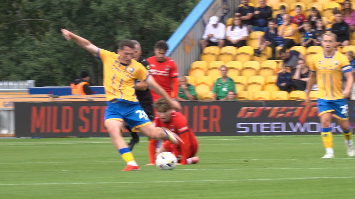 😱 Regan Hendry with a Goal of the Season contender from the halfway line! 👏