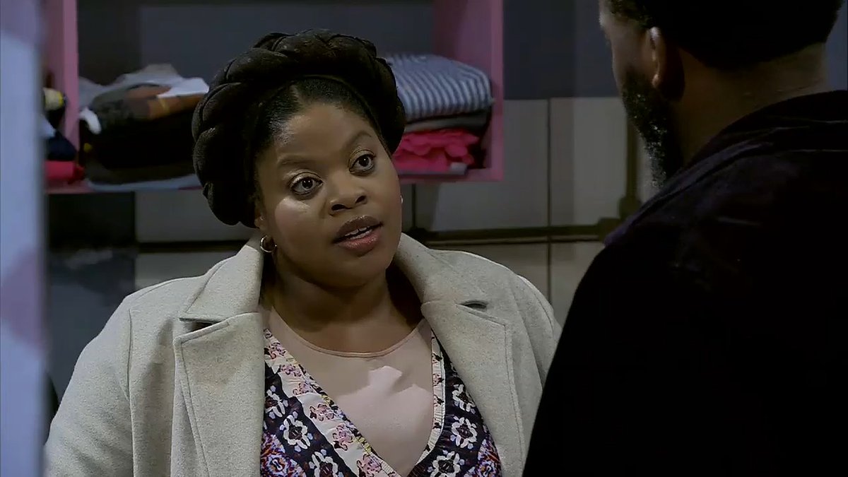 Lendoda mara, he has no shame! 😲 He’s marrying Dintle right outside Madlomo’s laundromat, forcing her to close the shop on the day. Do you think Dintle is being spiteful? #etvScandal
