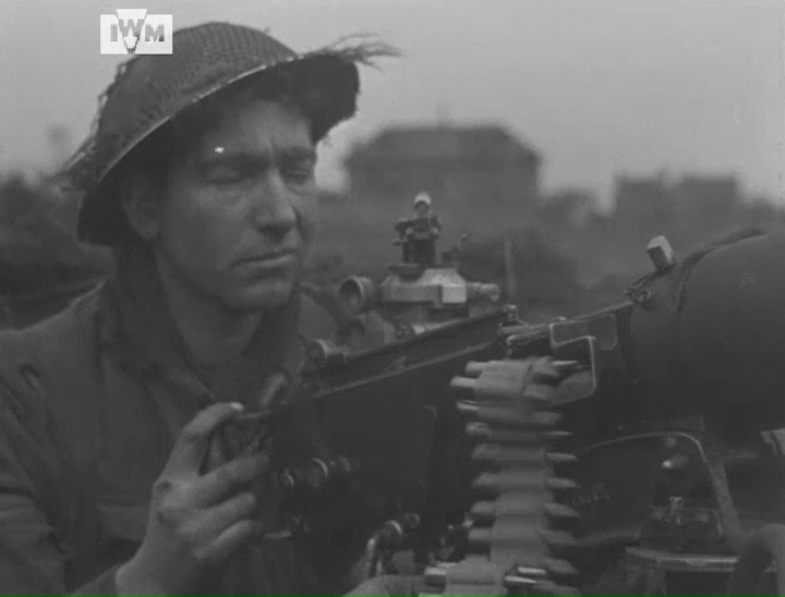 Two Vickers machine-gun detachments belonging to the 1st Battalion Middlesex Regiments 'A' company filmed in action on 46th Brigade's front, southeast of the villages of Liesel and Slot near the Canal de Deurne, Holland, 2 November 1944. Film: IWM A70 189-4