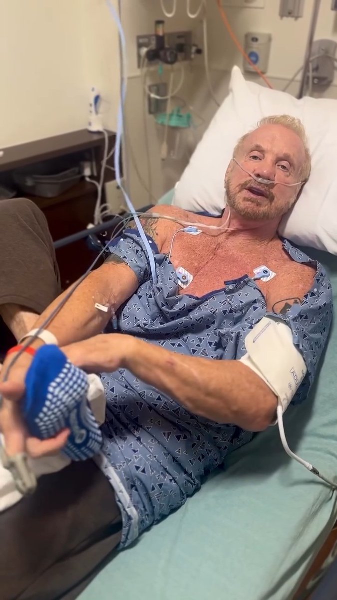 Minutes after waking up from a successful cardioversion, I’m back stretching. My wife, Payge McMahon (aka Payge Page) is like… ‘can you just rest for 24-hours?’ 🤪 Last week, I went into AFib. I normally wear a heart monitor when training, but for some reason didn’t this day. I pushed myself too hard, felt ‘off’, dizzy, and heart racing… and well, here we are… This is my 2nd time with AFib (irregular heartbeats) in the past 3 years. I’ll have a cardio ablation next month and should be good to go. I will never not wear a heart monitor and/or Apple watch when working out again. I promise Payge🙏🏼! If you are over 50 and or have a slightly enlarged heart, you should wear a heart monitor too! DDPY #afib