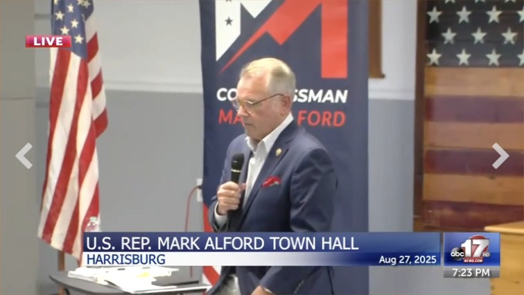 Republican Congressman Mark Alford is booed by his constituents after saying "Trump has the best interest of Americans."