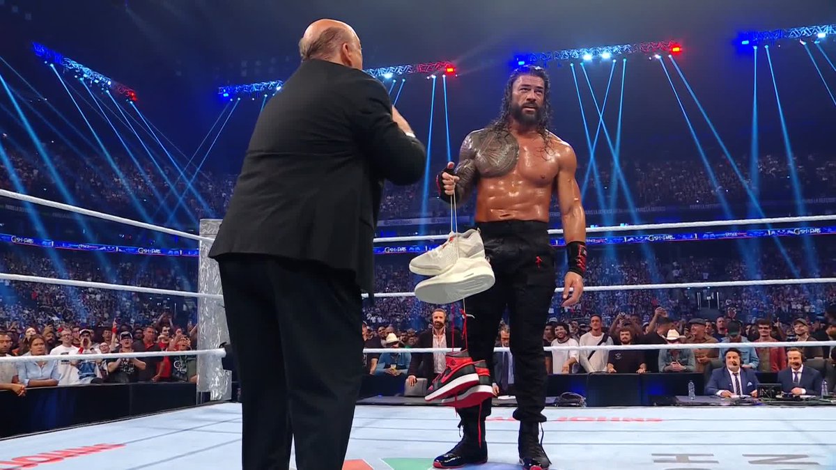 Roman Reigns gets his shoes back and DOWN GOES PAUL HEYMAN! 👟👀
