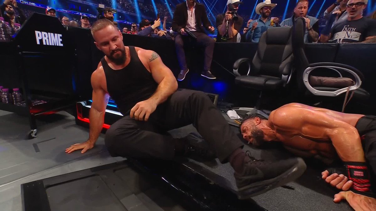 BRON BREAKKER JUST SPEARED ROMAN REIGNS THROUGH THE ANNOUNCE TABLE! 😱😱😱