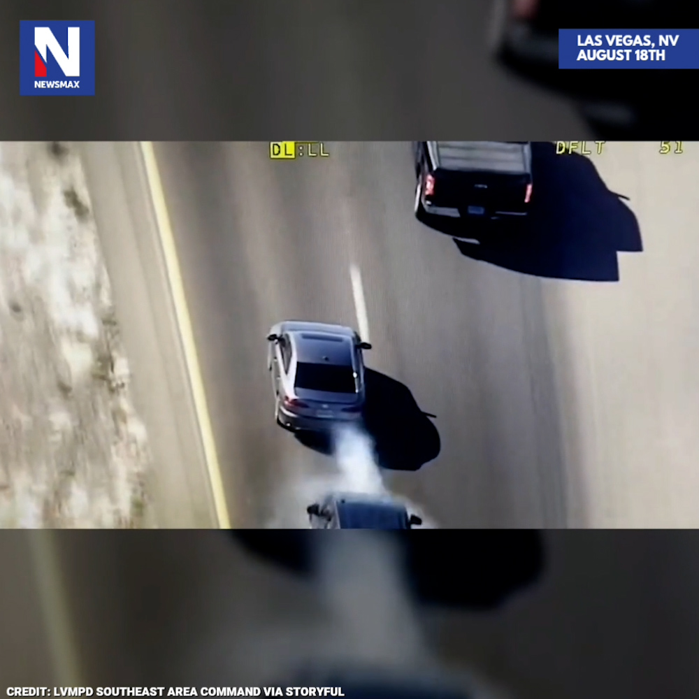 TACTICAL TAKEDOWN: Amazing aerial footage captures Las Vegas police using a grappler tool to stop a carjacking suspect during a high-speed chase last month. Officials also learned the suspect was wanted on an attempted murder warrant.