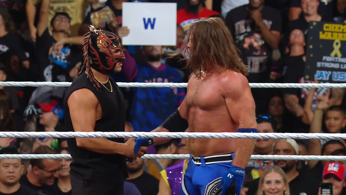 ONE AMERICANO DOWN. TWO AMERICANOS DOWN. AJ Styles + Dragon Lee = 🔥
