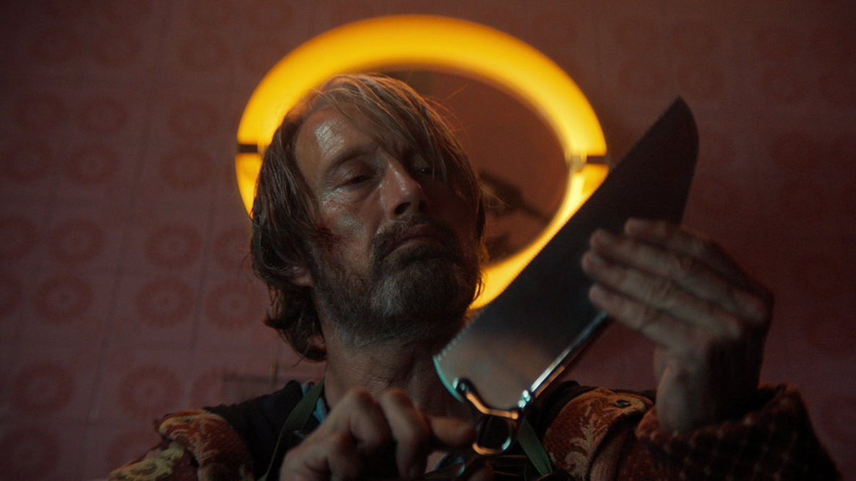 In Dust Bunny, Mads Mikkelsen plays a hit man for hire who takes a job from a ten-year-old who believes monsters ate her entire family.