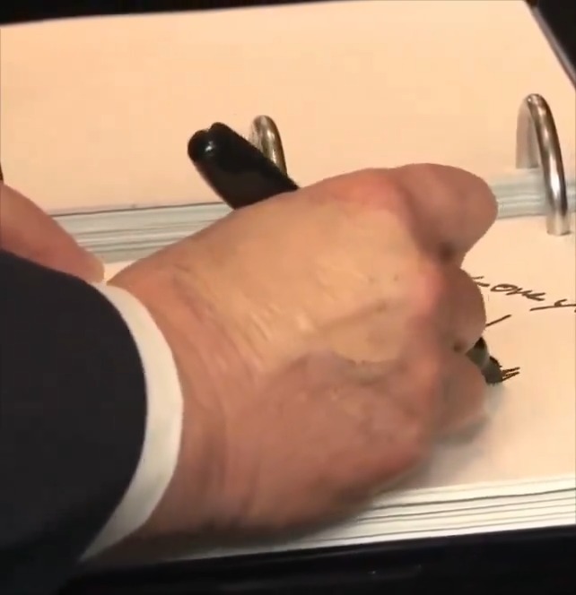 BREAKING: After the Pentagon Moved the September 11th ceremony indoors unexpectedly, just now, Trump signs a memorial book (HAND STILL HAS MAKE-UP ON IT) and then mumbles a bit before walking out. I think it's fair to question his health at this point.