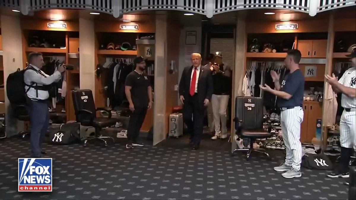 JUST IN: President Trump receives a warm welcome as he greets Yankees players in the clubhouse before watching the game on the anniversary of September 11th.