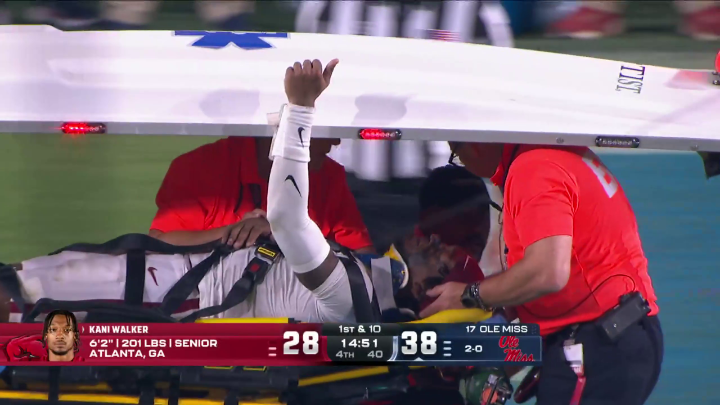 Arkansas DB Kani Walker was carted off the field with an apparent injury.