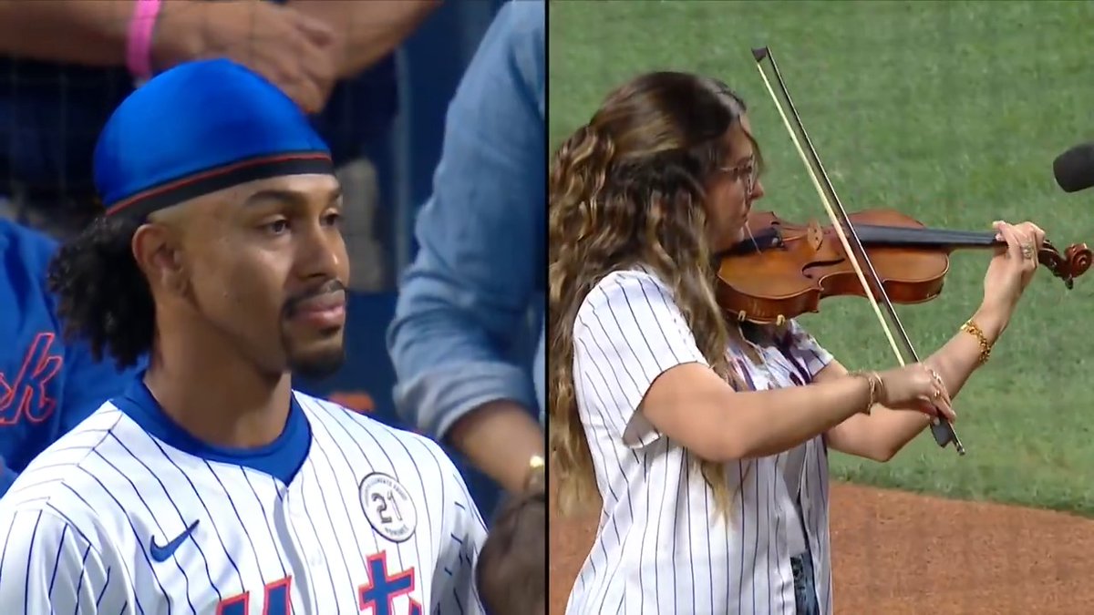 Francisco Lindor watches his wife Katia finish playing the National Anthem at Citi Field along with his family 💙