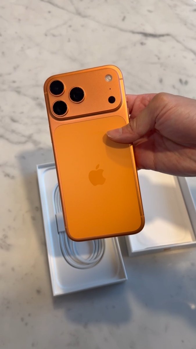 It's an orange iPhone 17 Pro Max.