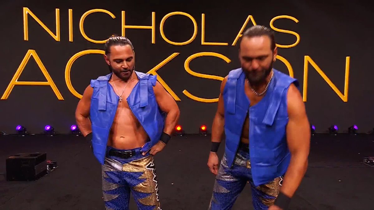 YOUNG BUCKS GOT BACK THEIR: • Proper Theme Music • Proper Introduction • Proper Nameplates • 100% FULL PYRO AND THEY'RE HANDING DOLLAR BILLS TO ALL THE FANS WHO ARE HOLDING BUCKS SIGNS. HAHAHAHA. This gimmick is an ALL-TIMER.