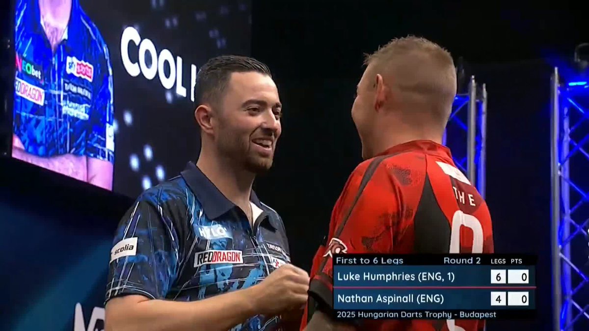 HUMPHRIES BEATS ASPINALL! ๐ Luke Humphries is up and running in Budapest! The world number one defies an average of 99 from Nathan Aspinall to book his place in Round Three! ๐บ #ET12 | R2