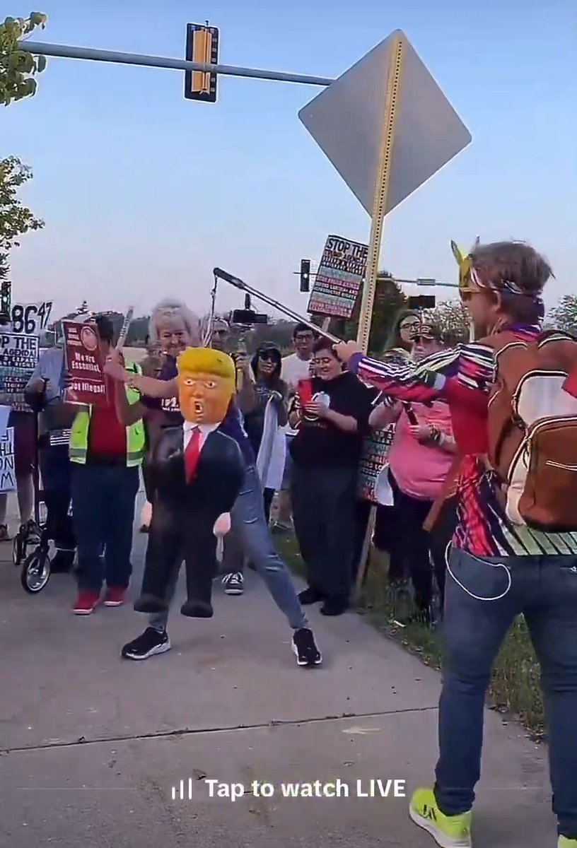 White liberal lady wearing a "Make America Kind Again" MAKA shirt decapitates a Trump doll. You can't make this shit up.... 🤡 #19th #women #leftists
