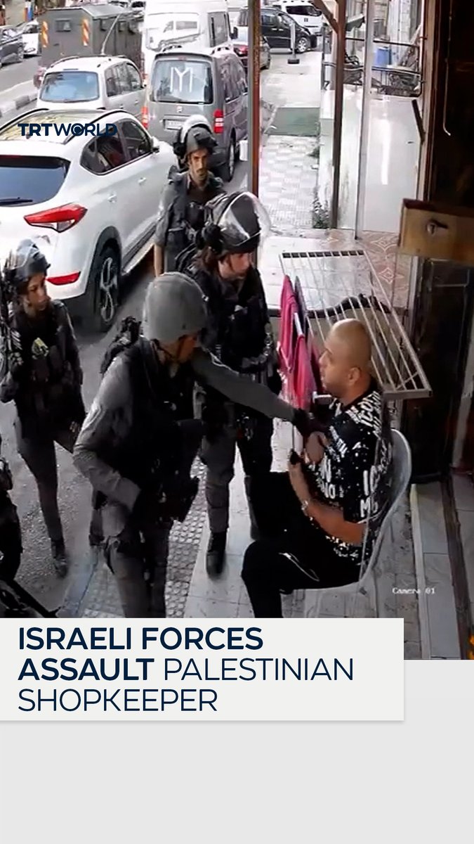Israeli occupation forces assault a Palestinian man sitting outside his shop in Dura, Hebron, in the occupied West Bank, after he refused to close it