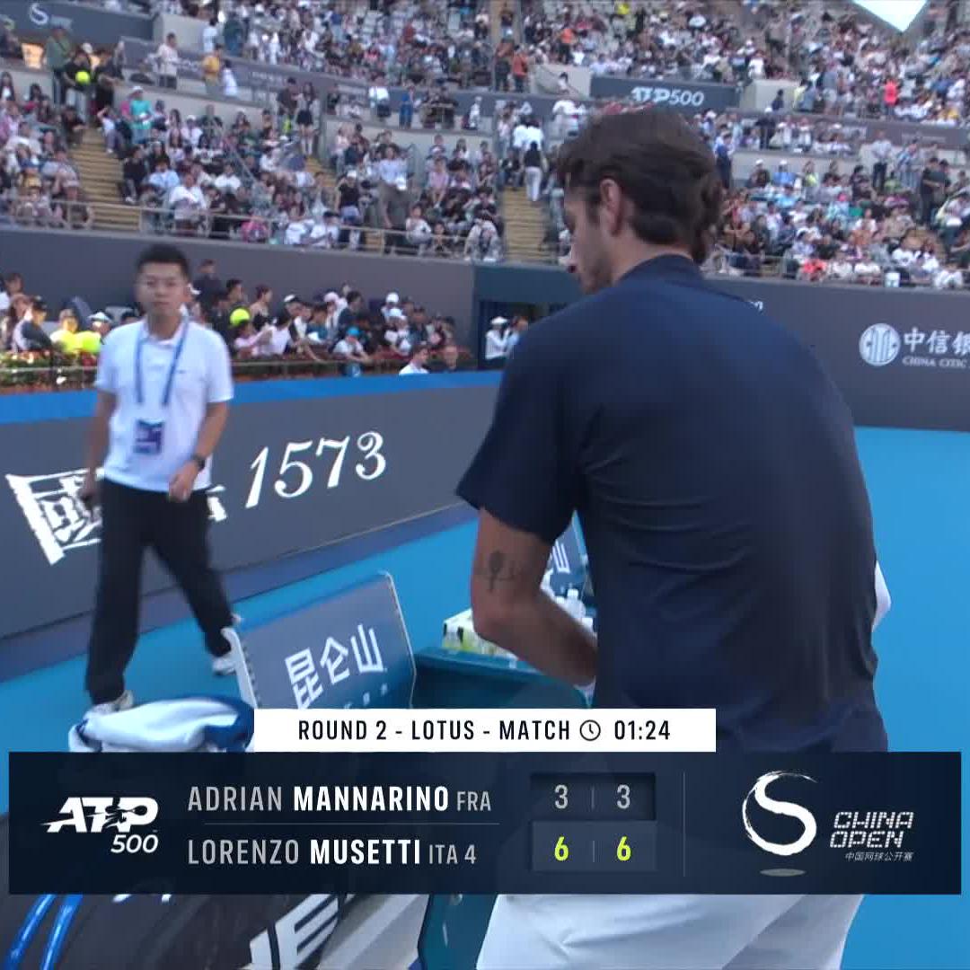 Musetti apologizes to the Chinese crowd after reaching the QFs in Beijing.