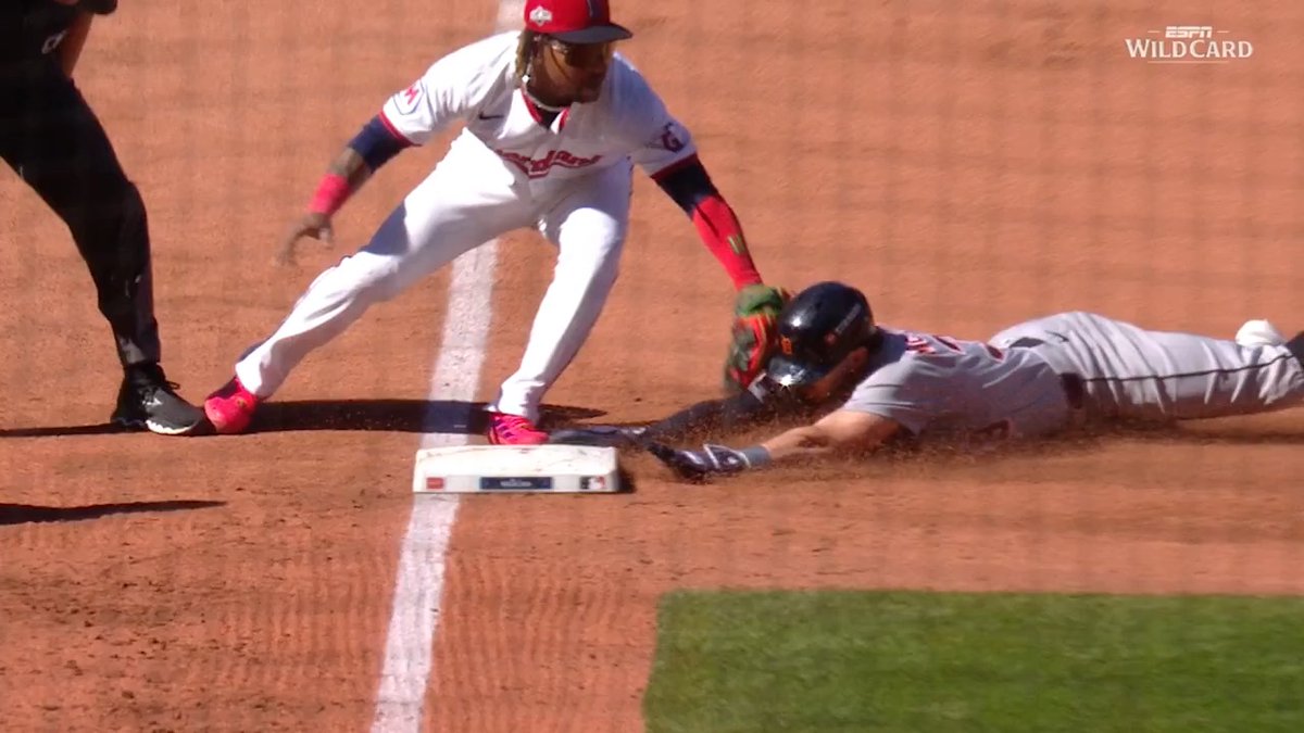 Javy Báez ties the game for the @Tigers! After review, the out at third base happened BEFORE the go-ahead run crossed the plate 🤯 #Postseason