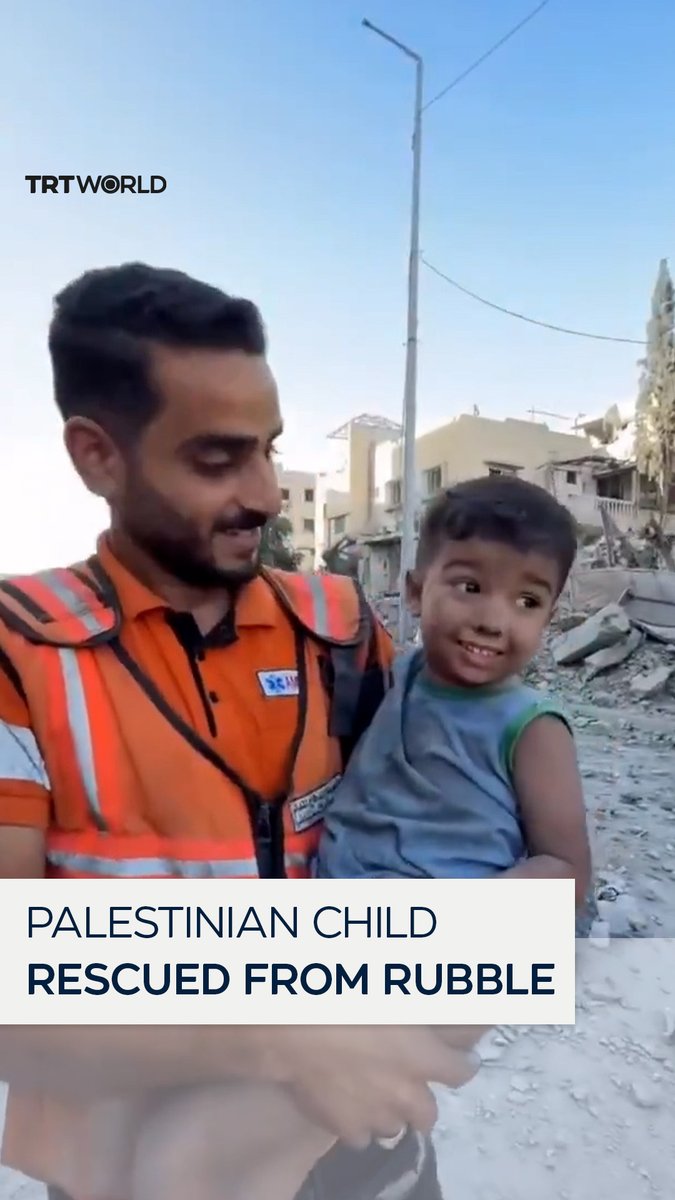 "I am okay." A Palestinian child rescued from rubble after an Israeli attack speaks to the first responders who helped him