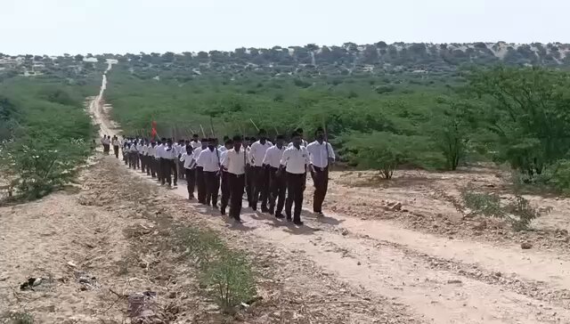 RSS militants carried out a march towards the Pakistan border, Khokhrapar–Munabao crossing in Barmer District, in full display of its extremist ideology to mark its 100th anniversary. Narendra Modi's fascist regime is inadvertently a political front of the RSS. When Modi first took office as PM in 2014, 41 members of his govt’s 66-person cabinet had an RSS background. Today, 38 out of 53 ministers — nearly 75% — hail from the RSS. Infact Narendra Modi and the RSS Chief Mohan Bhagwat, who ordered the Samjhauta Express blasts, have an old affiliation which goes back to 1967, when both were 17. Bhagwat’s father Madhukarrao was mentor of Modi. He stayed with the Bhagwat family during his essential training. Today, RSS is the largest Neo Nazi group of the world with an estimated 1.5 – 2 million regular participants in its nearly 57,000 shakhas across 36,293 locations nationwide along with an armed dedicated militia of 600,000. It has presence in atleast 39 countries world wide. India is effectively ruled by the RSS. Its political wing, the BJP, and its activist Prime Minister Modi have turned the Indian state into a vehicle for Hindutva expansionism. The most alarming development is the saffronisation of the Indian military. RSS men are not just influencing policy. They are sitting in high command positions within the armed forces. A recent report revealed that sixty two percent of India’s Sainik Schools, the very institutions that groom future officers, are run by RSS affiliates. This means the next generation of Indian generals will be ideologically trained in Hindutva first and military professionalism later. This deep infiltration has transformed the Indian armed forces into an extension of the RSS agenda rather than a neutral institution of the state. It is the militarisation of extremism. The RSS carries a blood-soaked legacy. It has been responsible for countless pogroms and massacres of Muslims in India. History records it as the organization that carried out the earliest terrorist attacks in the subcontinent including an assassination attempt on Quaid-e-Azam Muhammad Ali Jinnah. India today is not led by professional soldiers or neutral politicians. It is hostage to an extremist group that openly embraces fascism, militancy and terrorism under the garb of nationalism.